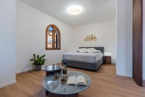 a living room with a bed and a table at Villa Domina by Letstay in Giardini Naxos