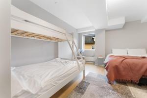 a bedroom with a bunk bed and a ladder at Stryn Apartments - City Center - Modern Suites in Stryn