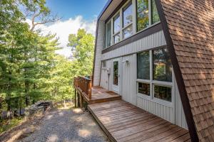 a house with a wooden ramp leading to the front door at 1186 Fairway Drive: Country Squire in Basye