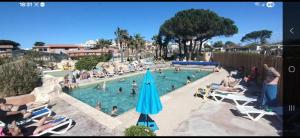 a group of people in a pool at a resort at La plage in Canet-en-Roussillon