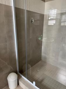 a shower stall with a toilet in a bathroom at Gottys Lagoon Stay in Walvis Bay