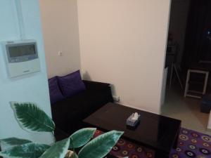 a living room with a couch and a table at F2 bien situe in Oran