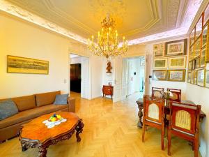 a living room with a couch and a table at 7th HEAVEN Vienna Center Apartments in Vienna