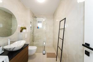 a bathroom with a shower and a toilet and a sink at Sky Lounge & More - Rooftop Wellness & Gym in Zadar +50 photos