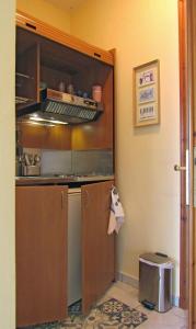 a kitchen with a sink and a counter top at Namastekala Holidays Studios in Chrysi Ammoudia
