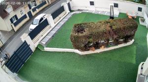 an aerial view of a building with a large tree at Big, very bright house in Beauvais