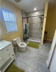 a bathroom with a toilet and a shower at Charming Key West Rental in Key West