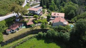 an aerial view of a house with a yard at Sobreiros House - Gerês in Terras de Bouro