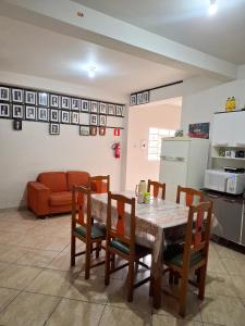 a kitchen and dining room with a table and chairs at República Mandala - Quarto duplo 2 in Ouro Preto