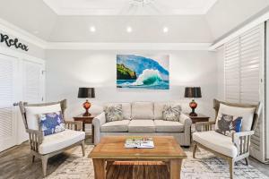 a living room with a couch and chairs and a table at Kiahuna 183 Ground Floor Ocean View PBAC in Koloa