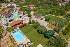 an aerial view of a house with a pool at Villa Šolo in Ploče