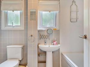 a bathroom with a toilet and a sink at 2 Bed in Saltash oc-95642 in Wotter +15 photos