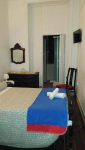A bed or beds in a room at Guest House 31 de Janeiro (AL)