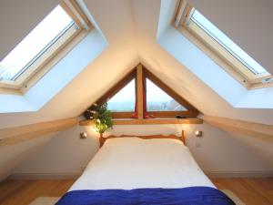 a room with a bed in a attic with skylights at 1 Bed in Somerton oc-asher in Compton Dando