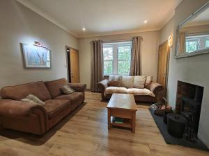 a living room with two couches and a fireplace at 1 Bed in Duns oc-83140 in Duns