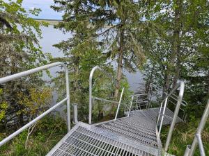 a metal staircase leading up to a body of water at River View Upstairs Apartment in Kenai