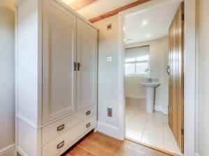 a bathroom with a large cabinet and a sink at 2 Bed in Belper oc-74965 in Crich +14 photos