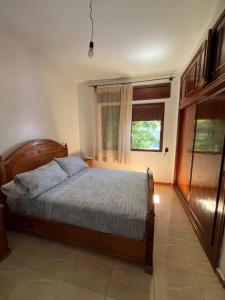 a bedroom with a bed and a window at Casa Barkouk Central Chefchaouen Apartment in Chefchaouen +69 photos