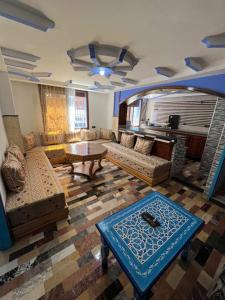 a living room with a couch and a table at Casa Barkouk Central Chefchaouen Apartment in Chefchaouen