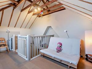 a white rocking chair in a room with wooden ceilings at 3 Bed in Brockenhurst oc-nfl92 in Brockenhurst
