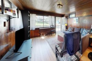 a living room with a couch and a chair in a train at The Pinkletink in Oak Bluffs