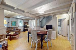 a living room with a table and chairs at Seabreeze Retreat in Oak Bluffs +15 photos