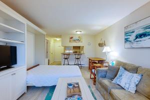 a living room with a bed and a couch at The Condo at Ocean Edge in Brewster