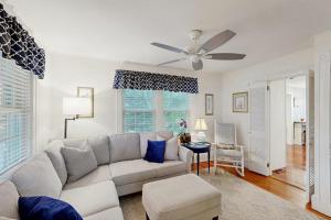 a living room with a couch and a ceiling fan at Edgartown Village in Edgartown