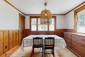 a dining room with a table and two chairs at The Cygnet in Falmouth
