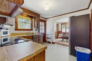 a kitchen with a refrigerator and a counter top at The Cygnet in Falmouth