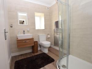 a bathroom with a toilet and a sink and a shower at 2 Bed in Lamesley oc-cn107 in Lamesley +11 photos