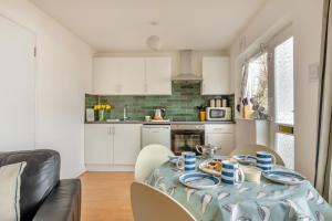 a kitchen with a table with food on it at 2 Bed in Brixham oc-f28884 in Brixham
