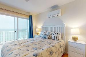 a bedroom with a bed with a view of the ocean at Bayside Beauty in Truro +20 photos