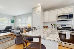 a kitchen and living room with a counter top at Bella Luna in Falmouth