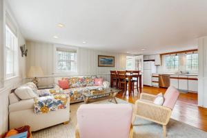 a living room with a couch and a table at Lucky Number Seven in Chatham