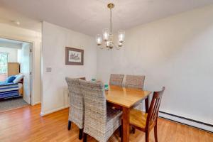 a dining room with a wooden table and chairs at Relaxing Cape Getaway in Brewster