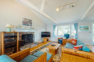a living room with a couch and a fireplace at Beaches n' Sunsets in Eastham