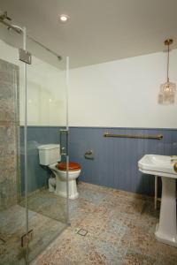 a bathroom with a toilet and a sink at The Pier Hotel in Kaikoura +16 photos