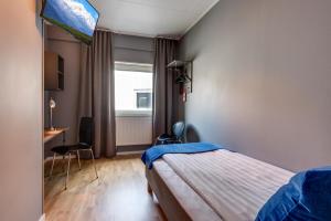 A bed or beds in a room at Aiden by Best Western Stockholm Arlanda Airport