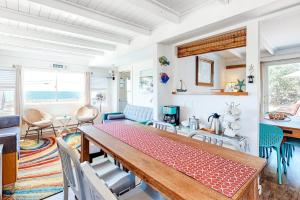 a dining room with a table and chairs at Dunes Edge in Wellfleet
