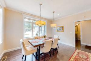 a dining room with a table and chairs at Cape Castle in Mashpee