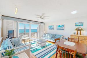a living room with a couch and a table at Bay Colony Vista in Provincetown