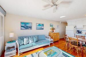 a living room with a couch and a table at Bay Colony Vista in Provincetown