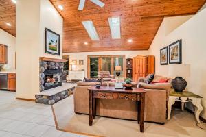 a living room with a couch and a fireplace at Between the Lakes in Glen Arbor +27 photos