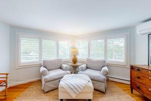 a living room with two chairs and a table at Lake Elizabeth Terrace in Centerville +41 photos