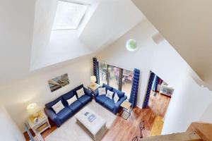 an overhead view of a living room with blue couches at South Cape Escape in Mashpee