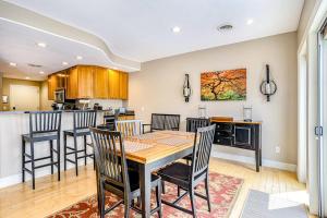 a kitchen and dining room with a table and chairs at Lake View Getaway in Saugatuck