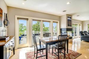 a kitchen and dining room with a table and chairs at Lake View Getaway in Saugatuck