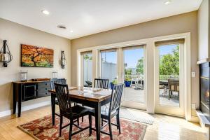 a kitchen and dining room with a table and chairs at Lake View Getaway in Saugatuck +31 photos