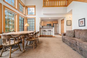 a living room with a couch and a table at Boyne Mountain Getaway in Boyne Falls